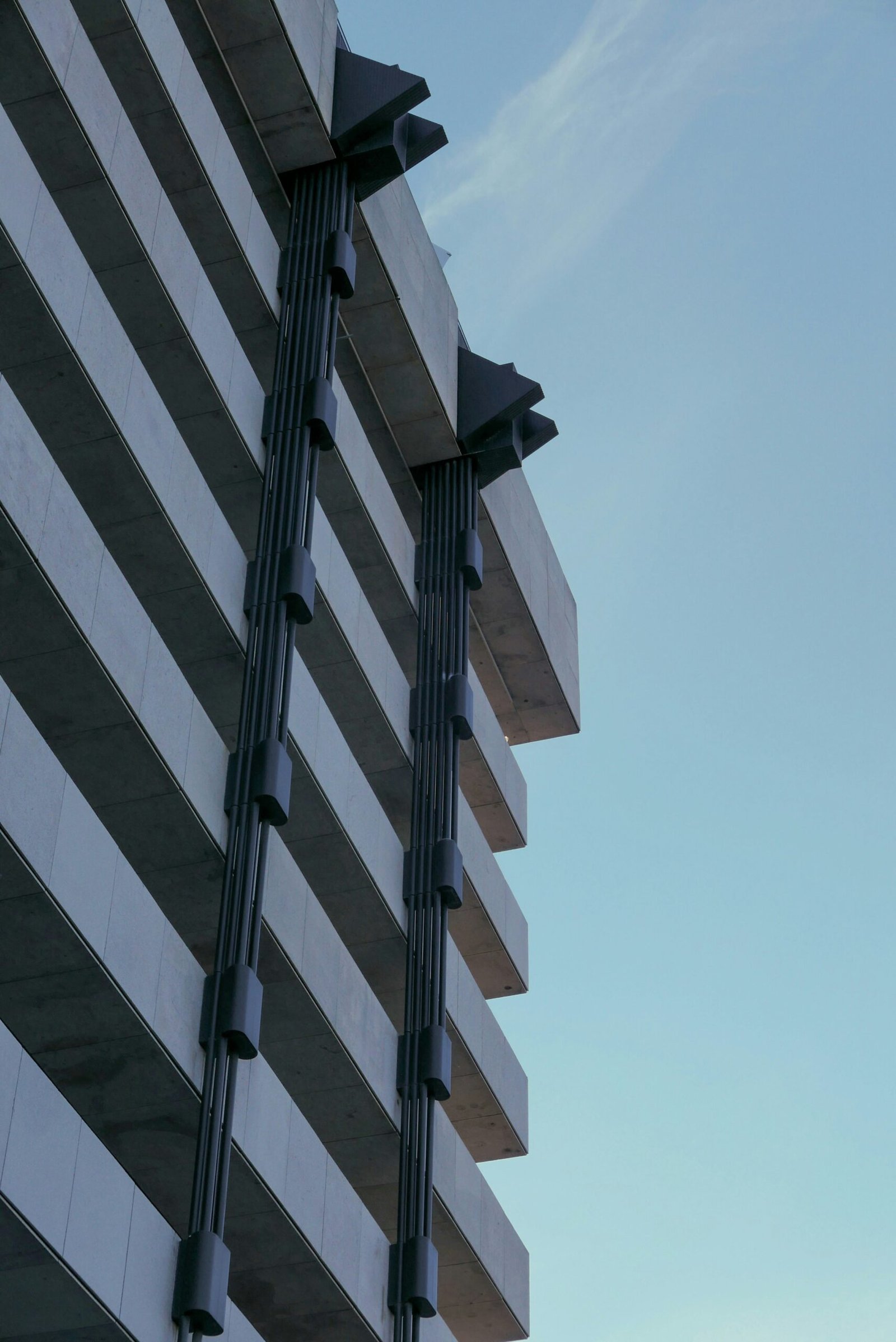 a tall building with a clock on the side of it